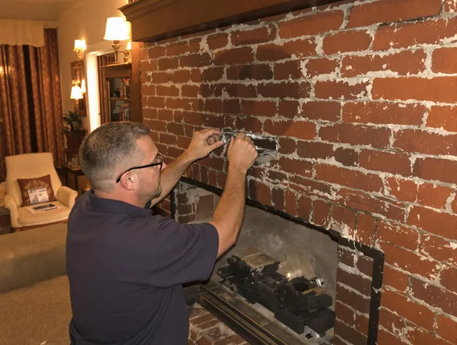 Mount Holly Chimney Sweep expert fixing a fireplace in Mount Holly, NC